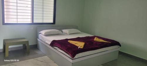 Postel nebo postele na pokoji v ubytování Greenstone Resort Hampi