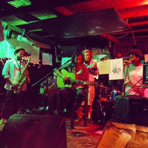 a group of people in a room playing music at Jungle Monkey Backpackers in Port St Johns