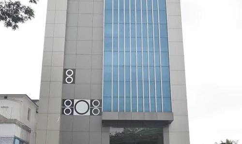 a tall building with circles on the side of it at FabHotel Shivani International in Rānchī