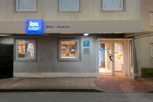 a building with a sign that reads bus driver controller at Ibis Budget Bilbao Barakaldo in Barakaldo