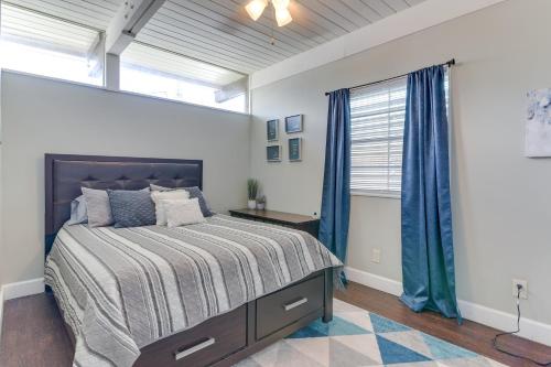 a bedroom with a large bed and a window at Galveston Vacation Rental - Walk to the Beach! in Galveston