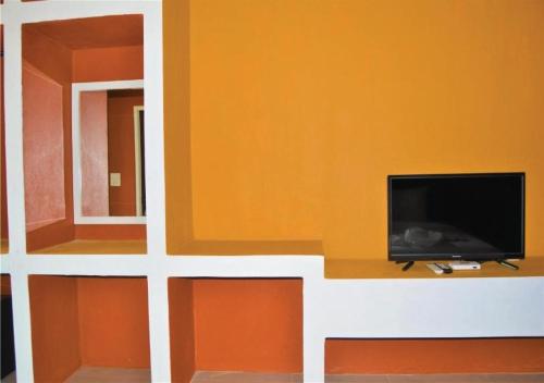 TV a/nebo společenská místnost v ubytování World Cat Beach & Resort เวิลด์แคท บีช แอนด์ รีสอร์ท