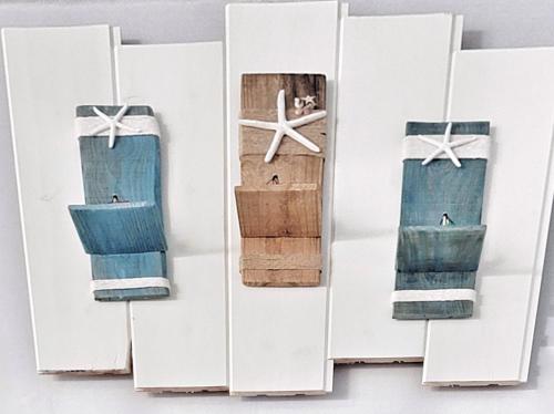 a group of four wooden displays with towels at Aewol Torini in Jeju