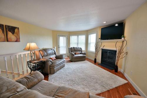 a living room with two couches and a fireplace at Unit 109 2 BDRM 2 BA condo in Birchwood