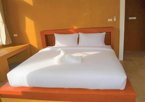 Postel nebo postele na pokoji v ubytování World Cat Beach & Resort เวิลด์แคท บีช แอนด์ รีสอร์ท