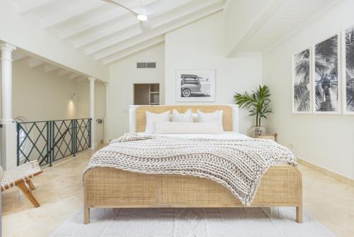 a bedroom with a large bed in a room at "Beach Happy" Schooner Bay - Beachfront Apartment in Saint Peter