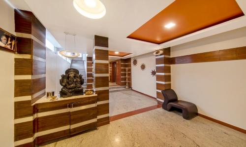a hallway with wood paneling in a house at Treebo Sam Residency in Coimbatore