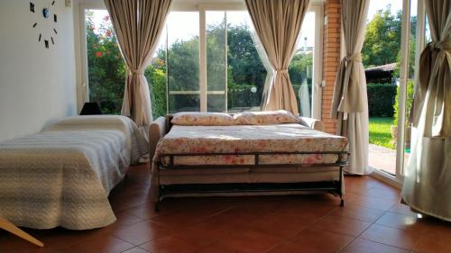 En eller flere senge i et værelse på La casetta nel verde