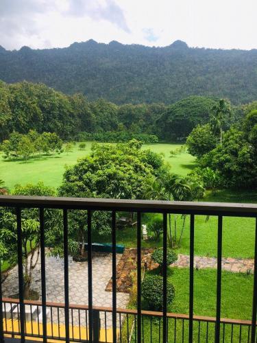 a view of a golf course from the balcony of a resort at เพชรมณีกาญจน์ บีช รีสอร์ท in Ban Plai Huai Kaeng Riang