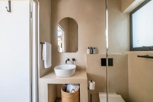a bathroom with a sink and a mirror at SALT in Jeffreys Bay