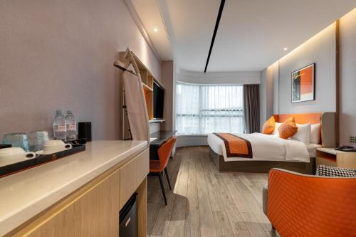 Postel nebo postele na pokoji v ubytování Guangzhou Yunjia Hotel - Airport Terminal 2