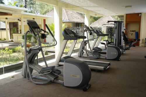 a row of exercise bikes in a gym at Tanjung Rhu Resort in Tanjung Rhu 