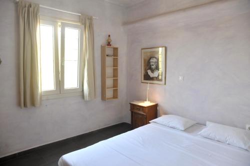 Ένα ή περισσότερα κρεβάτια σε δωμάτιο στο Naxos beach house, one minute away from the beach!