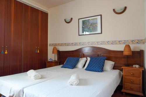 a bedroom with two beds with towels on them at Beach Breeze, Playa Santiago in Alajeró