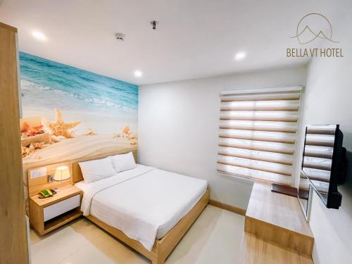 a bedroom with a bed and a window with the ocean at BELLA VT HOTEL in Vung Tau
