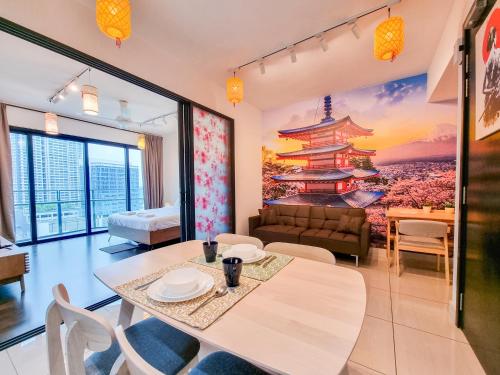 a living room with a table and a couch at Almas Suite by Nest Home【Puteri Harbour & LEGOLAND】 in Nusajaya