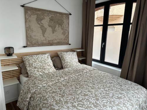 Ένα ή περισσότερα κρεβάτια σε δωμάτιο στο Appartement spacieux et tout confort