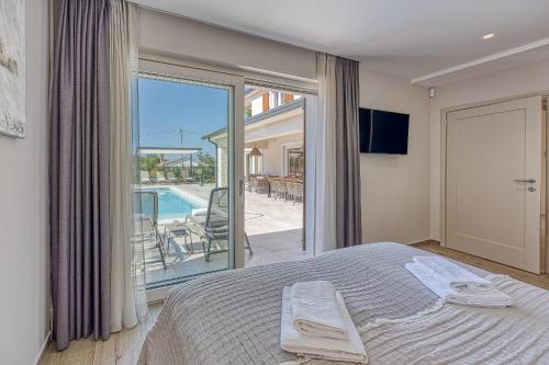 Ένα ή περισσότερα κρεβάτια σε δωμάτιο στο Villa Blagdan