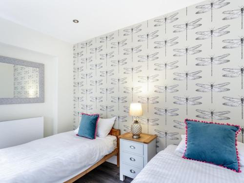 A bed or beds in a room at The Orange Tree Thornham