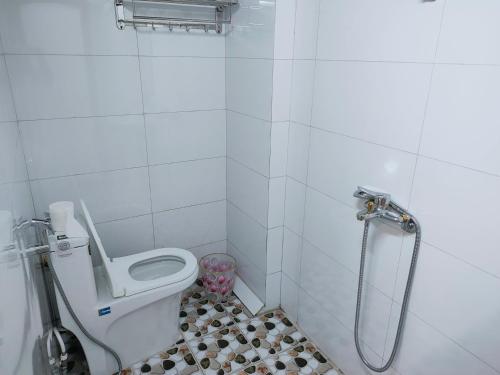 a bathroom with a toilet and a shower at Thanh Dũng Hotel Sapa in Sa Pa
