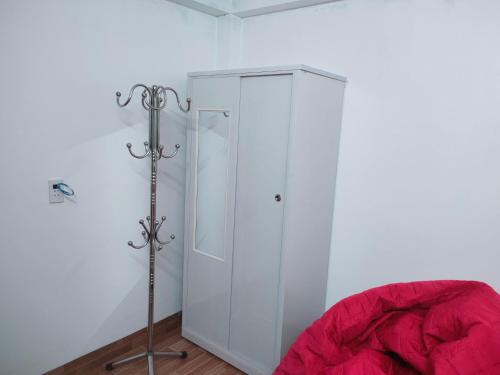 a white cabinet in the corner of a room at Thanh Dũng Hotel Sapa in Sa Pa