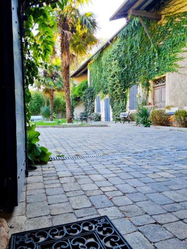 a patio with a grate in the middle of a building at Lyon Faubourg - Saint Priest in Saint-Priest