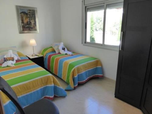 Posteľ alebo postele v izbe v ubytovaní Dalí Apartment