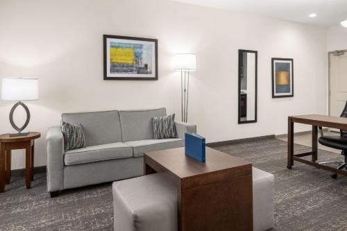 a living room with a couch and a table at Homewood Suites By Hilton San Marcos in San Marcos