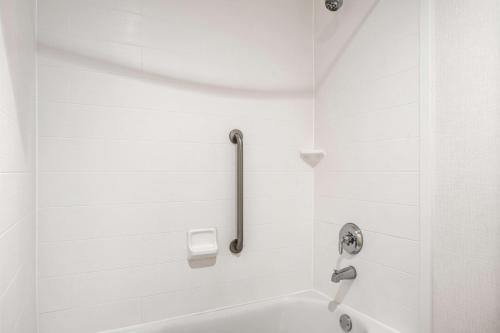 a white bathroom with a shower with a sink at Homewood Suites By Hilton San Marcos in San Marcos