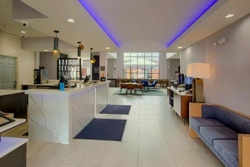 a lobby with a kitchen and a living room at Homewood Suites by Hilton South Bend Notre Dame Area in South Bend