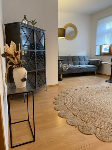 a living room with a couch and a table at Bording Appartment La Romantica in Fulda
