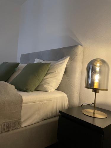 Кровать или кровати в номере Bording Appartment La Romantica