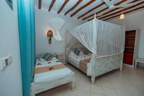 Voodi või voodid majutusasutuse Twiga Beach Resort toas