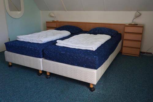 Postel nebo postele na pokoji v ubytování Kustverhuur, Park Schoneveld, Stern 233
