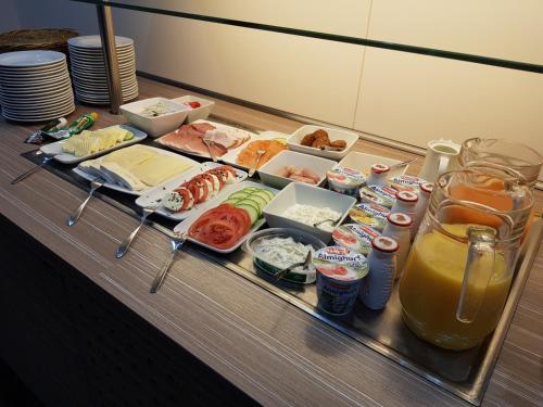 a buffet with sushi and other food on a table at Hotel Mühleneck in Schortens