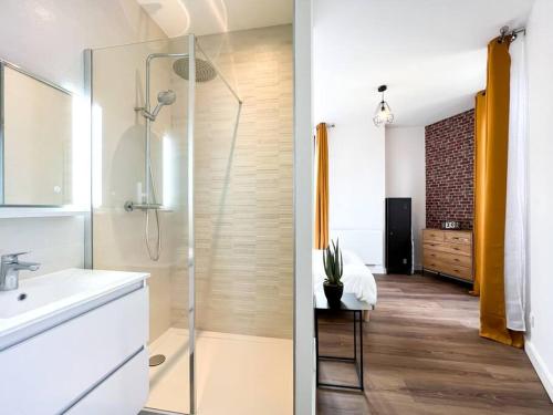 a bathroom with a shower and a sink and a bathroom with at Hyper centre de Grenoble, esprit industriel - fibre in Grenoble