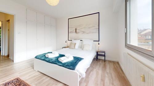 Кровать или кровати в номере Appartement La Fecht + parking