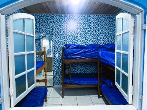 Katil atau katil-katil dalam bilik di Casa Temporada Bertioga