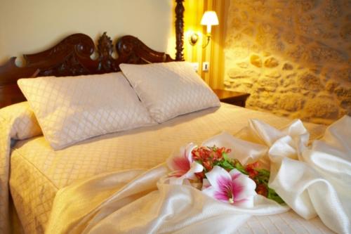 Postel nebo postele na pokoji v ubytování Hotel Vila do Val