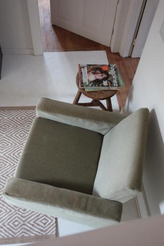 a living room with a couch and a table at la maison haute in Toucy