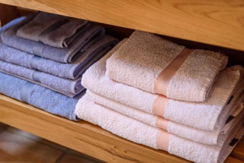 a bunch of towels are arranged in a drawer at Maison Magdeleine in Saint-Tropez