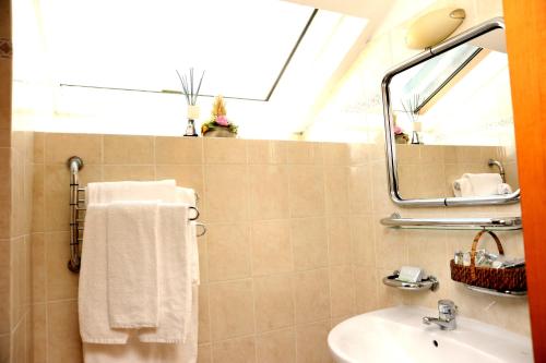 a bathroom with a sink and a mirror at Hotel San Siro Fiera in Milan