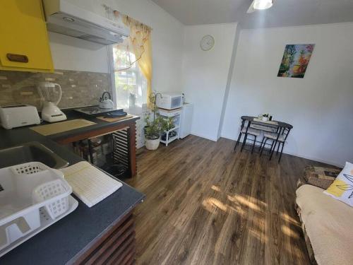 a kitchen with a table and a counter top at Bright apartment close to hwy in Edmundston