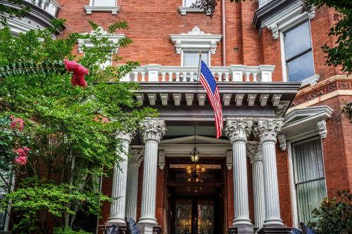 an american flag flying in front of a building at Kehoe House, Historic Inns of Savannah Collection in Savannah