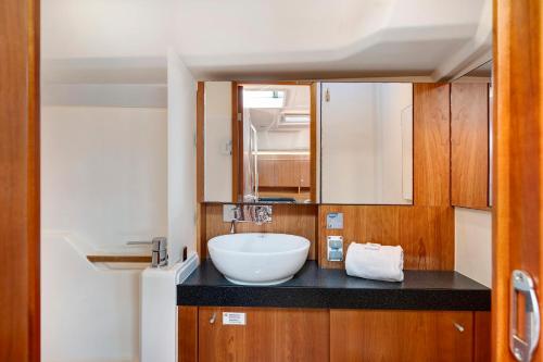 a bathroom with a sink and a bowl on a counter at Sailboat Hanse 455 in Positano