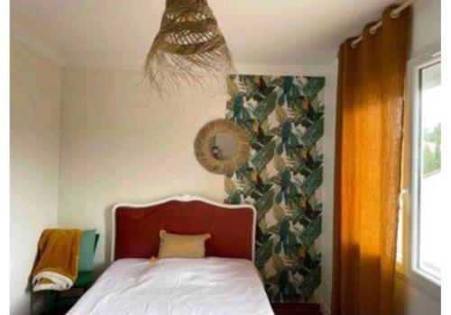 a bedroom with a bed and a curtain and a window at Torreilles-Casa terracota-plage - visa image- les déferlantes le Barcares - South of France in Torreilles