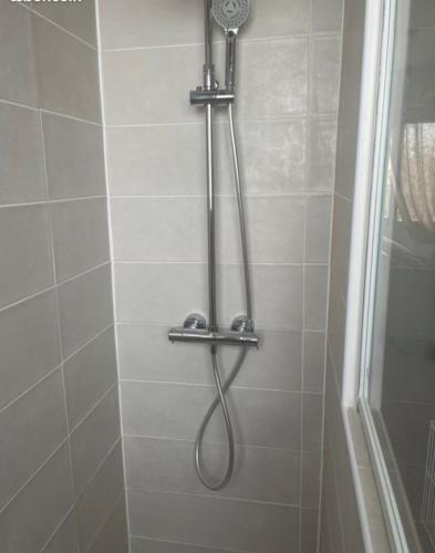a shower with a shower head in a bathroom at Torreilles-Casa terracota-plage - visa image- les déferlantes le Barcares - South of France in Torreilles