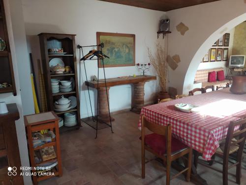 a dining room with a table and a table and chairs at casale fucino monolocale in Avezzano