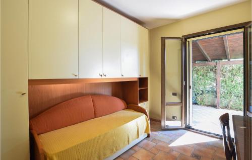a room with a bed and a sliding glass door at 4 Bedroom Awesome Home In Brucoli in Brucoli