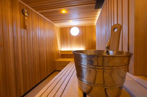 a metal tub in a wooden room with a sink at 10 St Marys in York